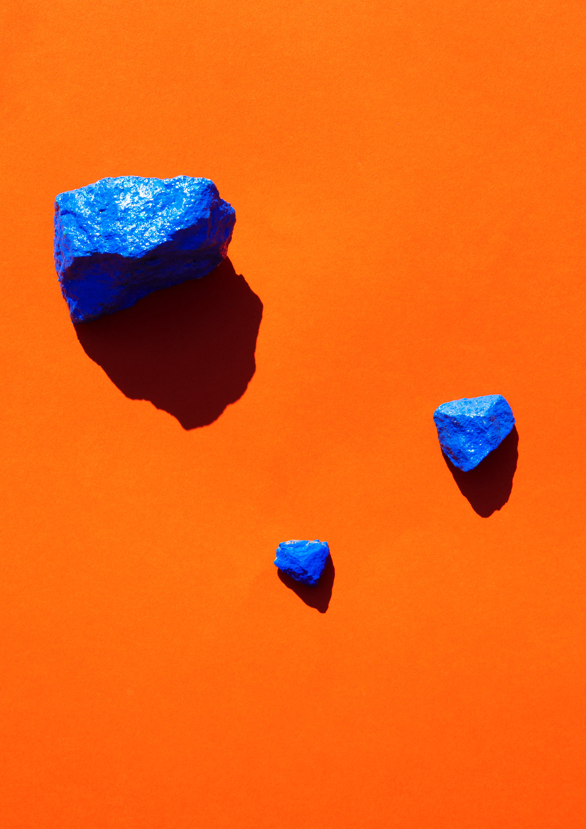 Coloured painted stones on a coloured background / Pop art style photo print