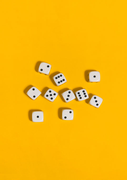Black-and-white dices on a yellow background / Pop art style photo print