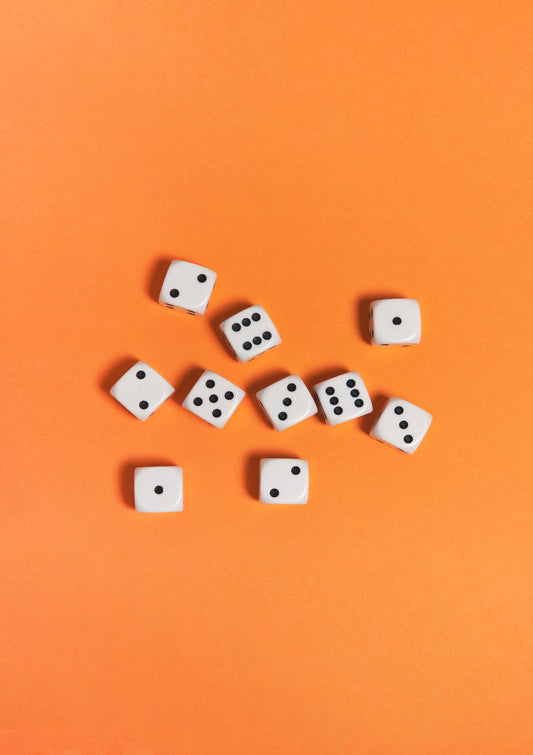 Black-and-white dices on a orange background / Pop art style photo print