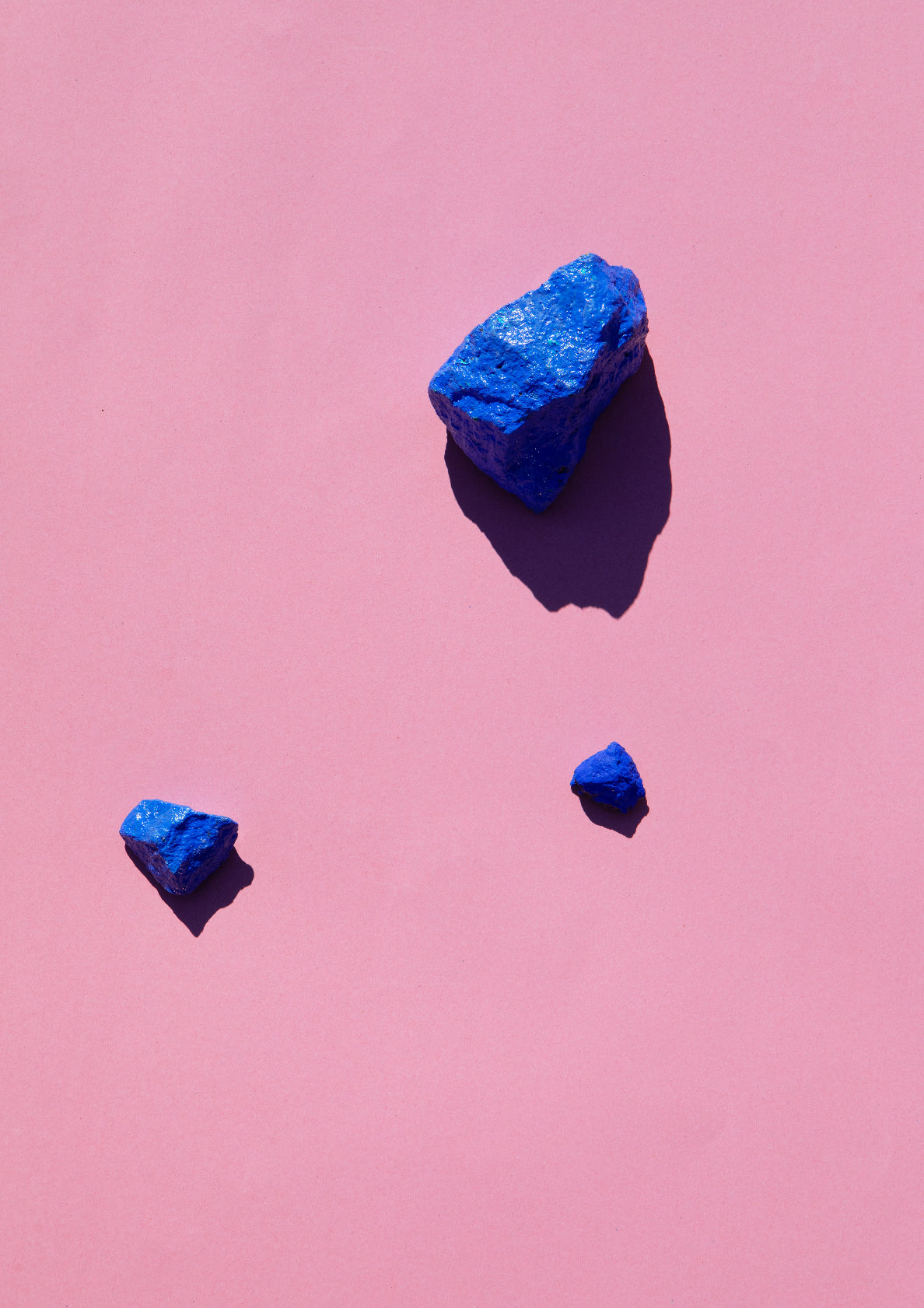 Coloured painted stones on a coloured background / Pop art style photo print