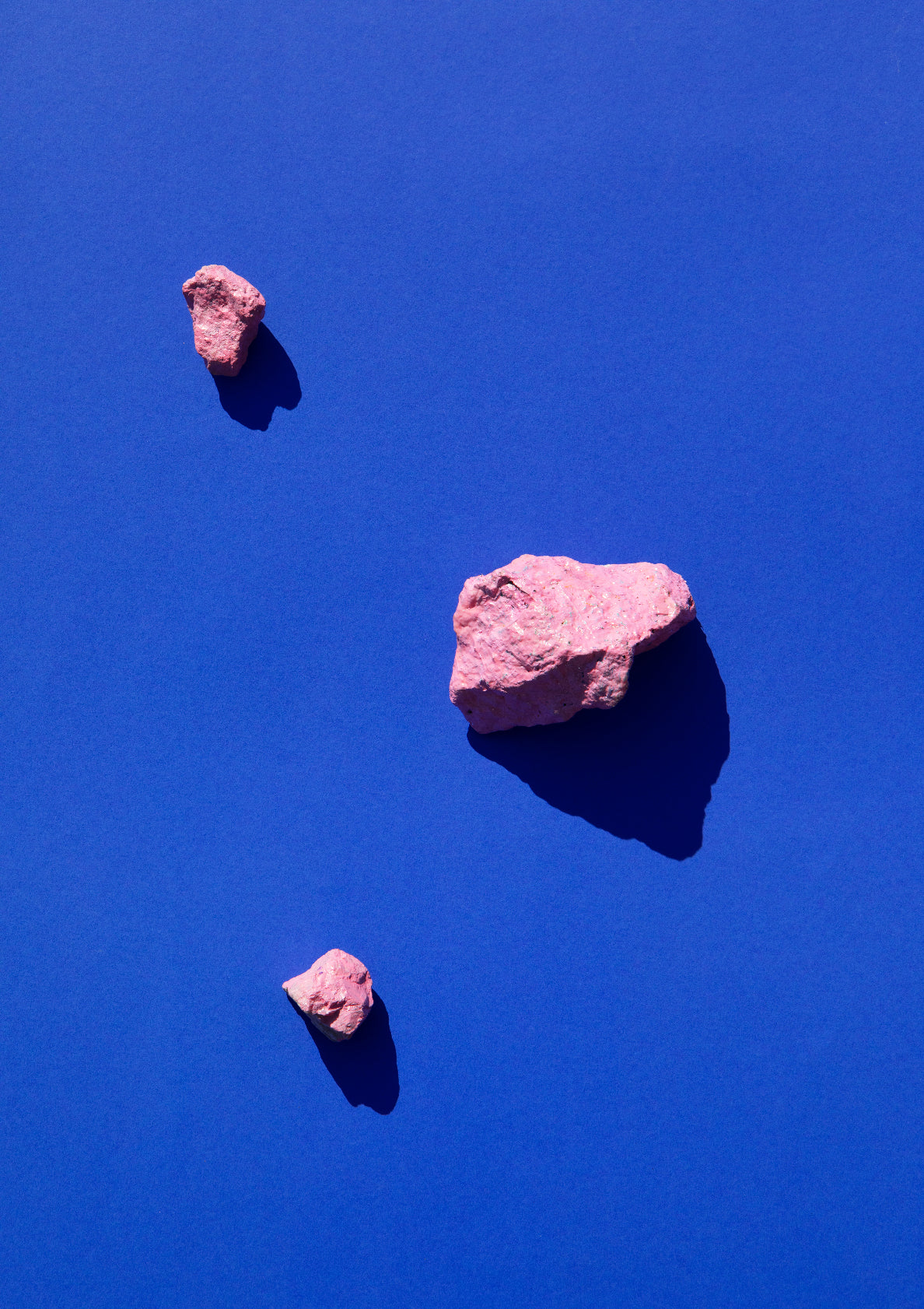 Coloured painted stones on a coloured background / Pop art style photo print