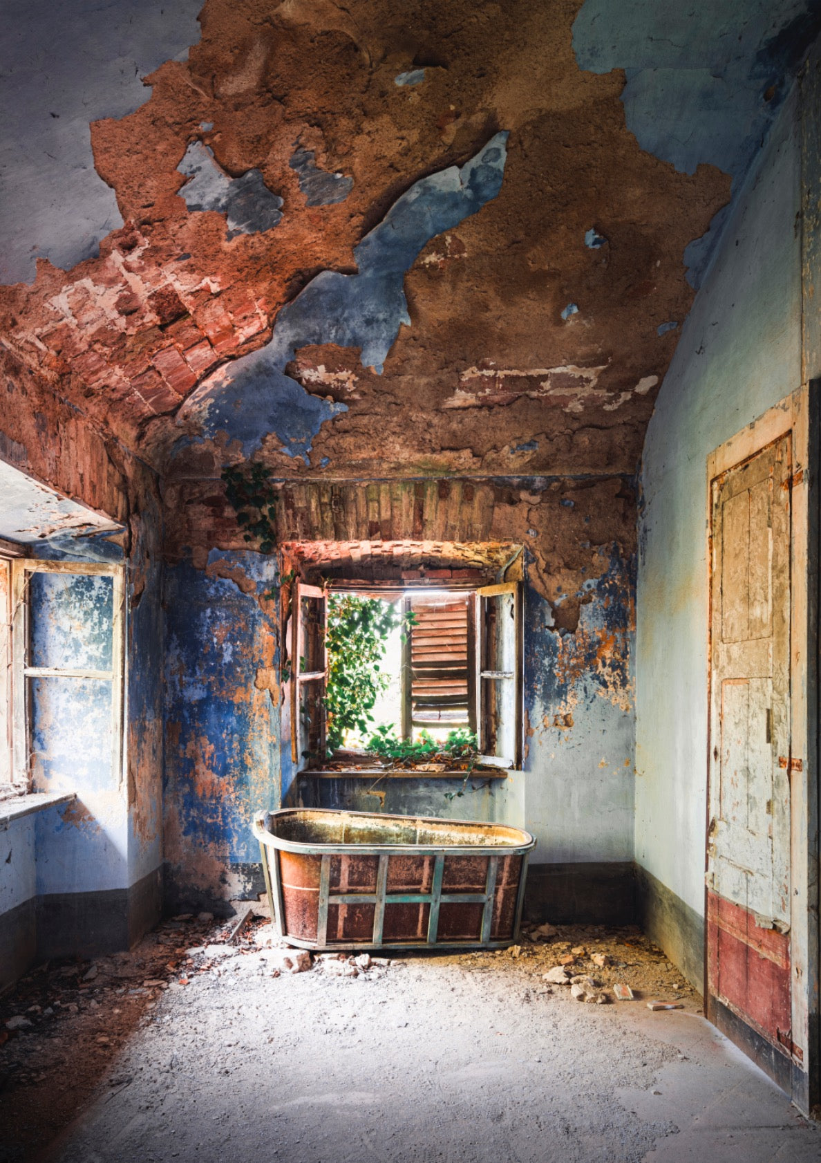 Abandoned Bathtub in Blue Room