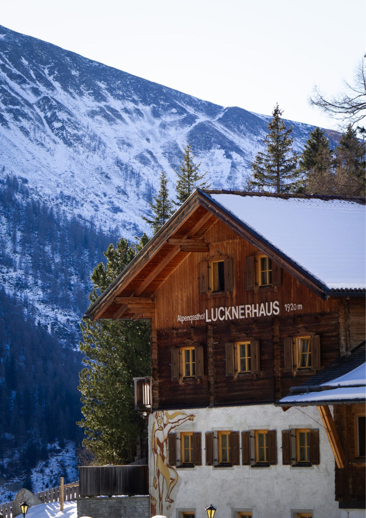 Alpine Lodge with Mountain Backdrop